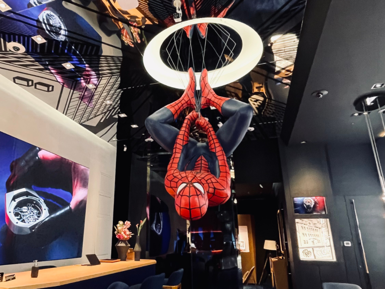 Boutique interior with a handbag suspended inside an illuminated ring