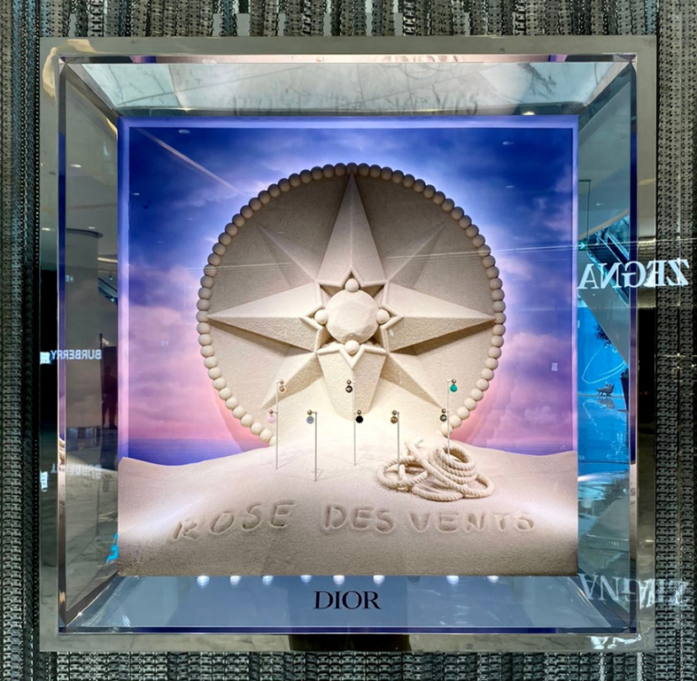 Dior Rose des Vents illuminated window with a sculpted star emblem in a mirrored box
